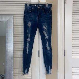 Dark blue distressed skinny jeans